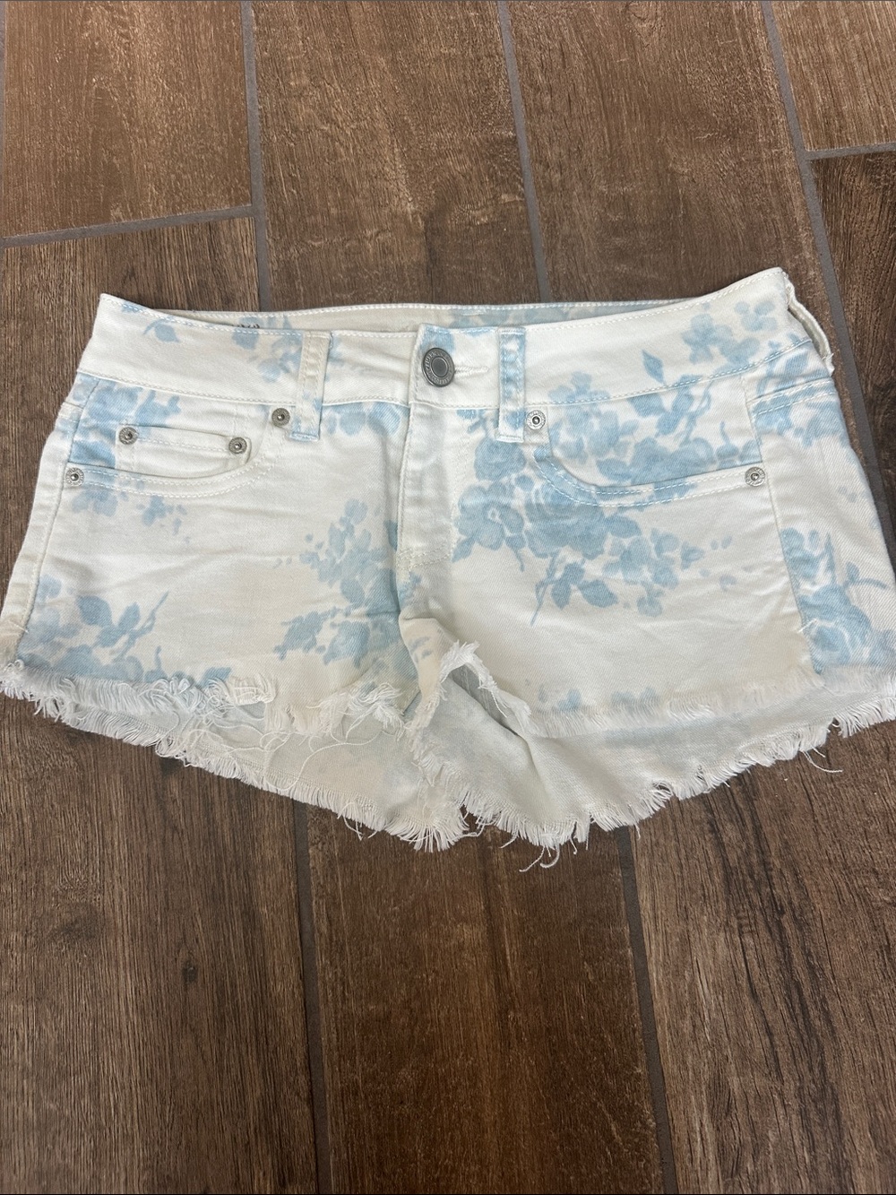 American Eagle Outfitters White Denim Floral Cutoff Shorts with Light Blue Print